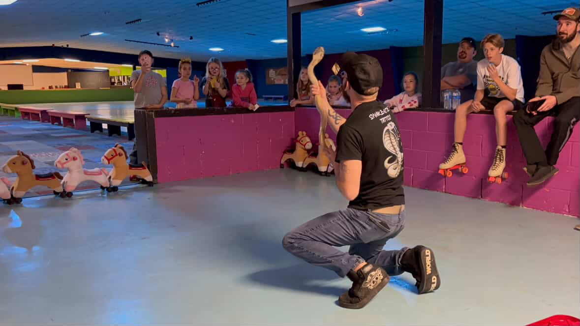 Joey demostrating Lilith the cobra.